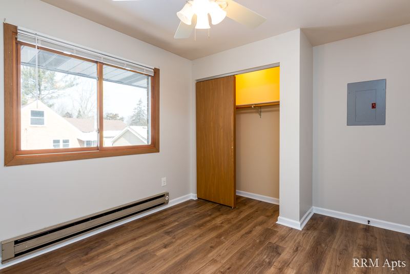 Bedroom with window, ceiling fan and open closet, Depot Road apartment 3